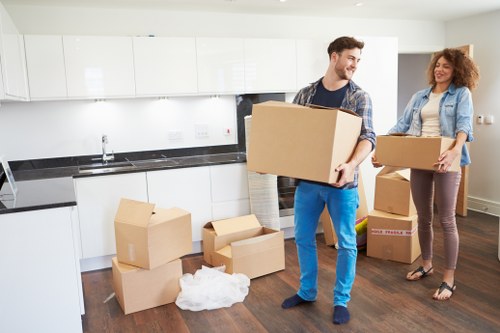 Professional movers loading furniture carefully