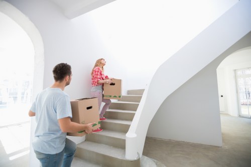 Packed boxes and furniture prepared for a man and van job in Longlands